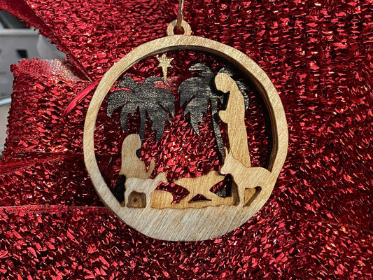 Three-layer nativity ornament.